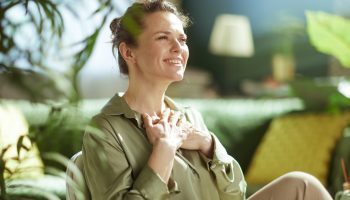 A,Serene,Woman,In,Her,40s,Holds,Her,Hands,Over