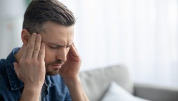 Closeup,Of,Middle-aged,Bearded,Man,Suffering,From,Headache,At,Home,