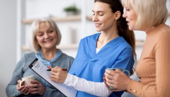 Friendly,Young,Woman,In,Blue,Workwear,Nurse,Questioning,Senior,Ladies