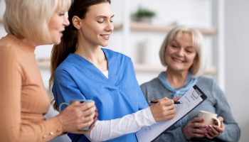 Friendly,Young,Woman,In,Blue,Workwear,Nurse,Questioning,Senior,Ladies