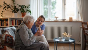 Caring,Healthcare,Worker,Visiting,A,Senior,Patient,At,Home,,Talking