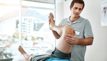 Knee,,Man,Or,Physiotherapist,With,Leg,Rehabilitation,In,Office,For