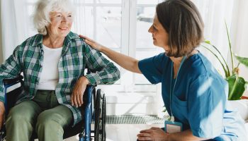 Side,View,Of,Friendly,Caregiver,Or,Nurse,In,Blue,Uniform