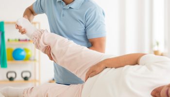 Close-up,Of,Personal,Physiotherapist,Rehabilitating,Senior,Woman's,Joints,After,Hip